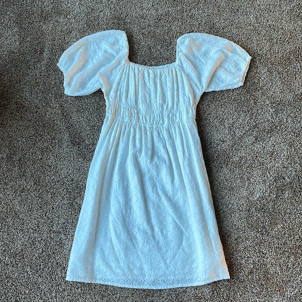 This is a Sim & Sam white sundress in the size medium